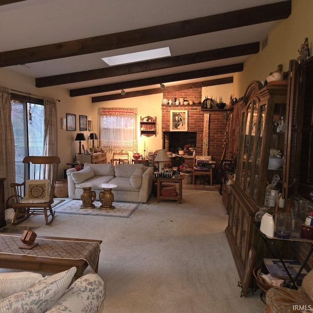 carpeted living area featuring a brick fireplace, a skylight, and beam ceiling