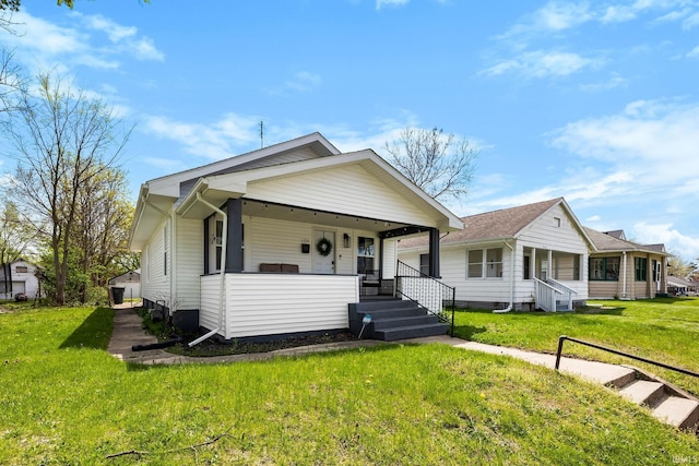 1314 Miner St, South Bend, IN 46617 - bungalow-style home featuring a porch and a front lawn