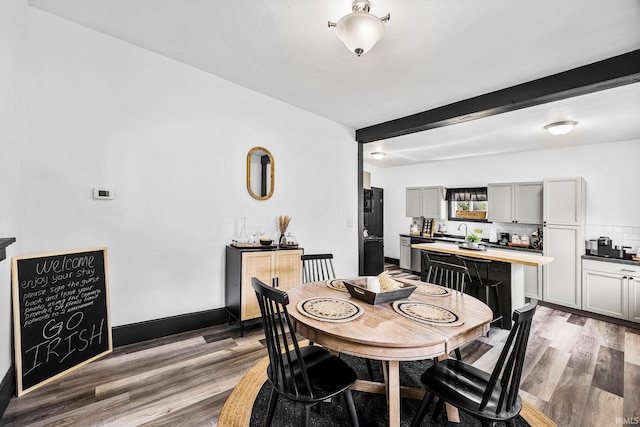1314 Miner St, South Bend, IN 46617 - dining room featuring beamed ceiling and light wood finished floors