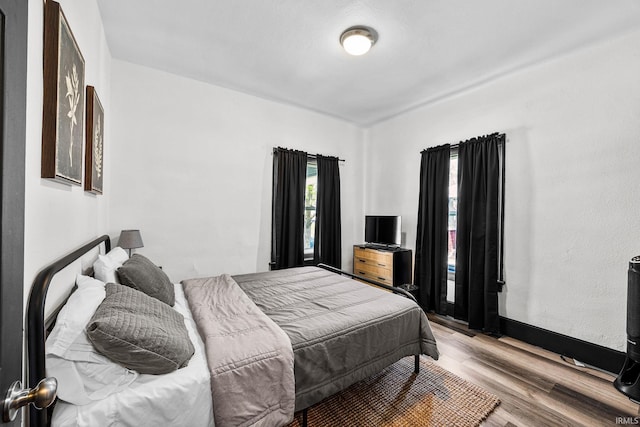 1314 Miner St, South Bend, IN 46617 - bedroom featuring baseboards and wood finished floors