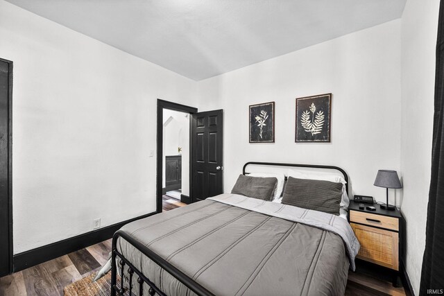 1314 Miner St, South Bend, IN 46617 - bedroom featuring baseboards and wood finished floors