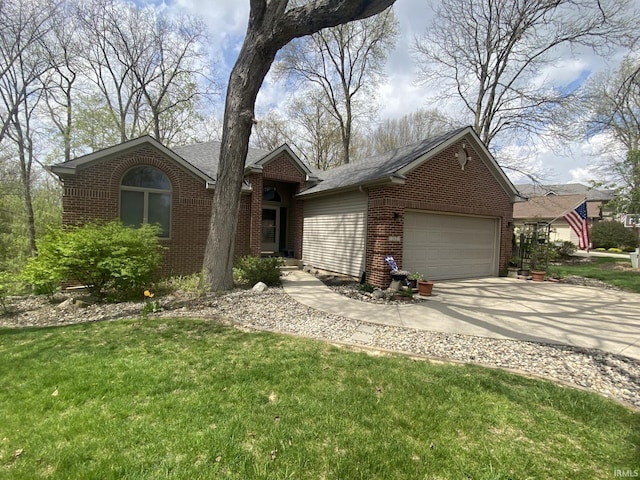 ranch-style home featuring a garage, a front yard, driveway, and brick siding