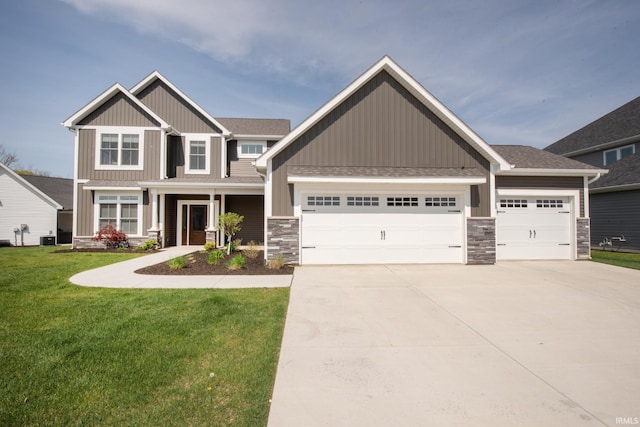 craftsman inspired home with an attached garage, a front yard, driveway, and stone siding