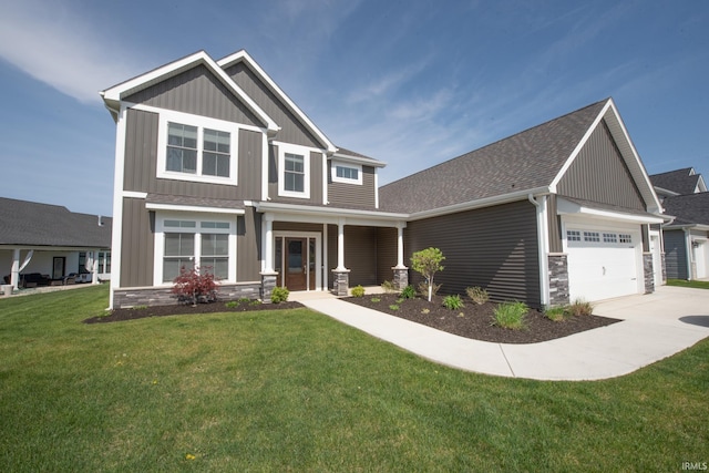 craftsman house with a garage, a front lawn, board and batten siding, and driveway