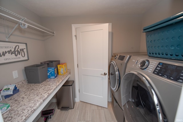 clothes washing area with laundry area and independent washer and dryer