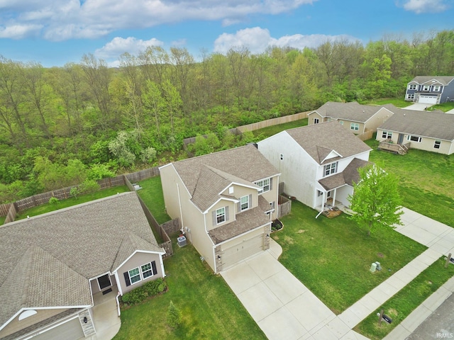 aerial view featuring a view of trees and a residential view