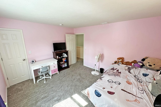 bedroom featuring visible vents, carpet, and baseboards