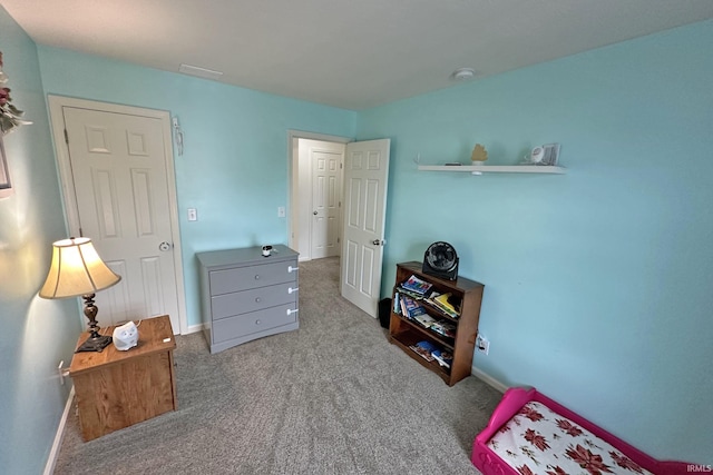 carpeted bedroom with baseboards and visible vents