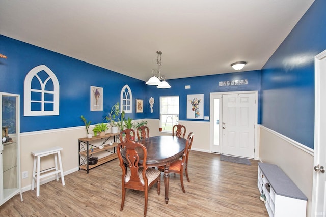 dining room with baseboards and wood finished floors