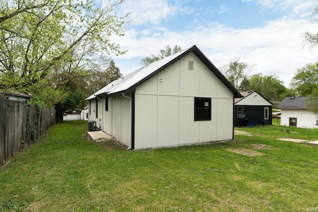 exterior space with a lawn and fence