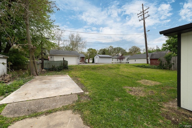 view of yard featuring fence and a patio