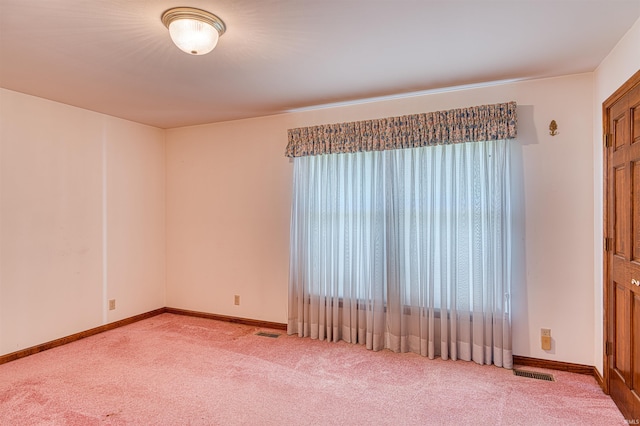 7001 Old Boonville Hwy, Evansville, IN 47715 - carpeted empty room with baseboards and visible vents