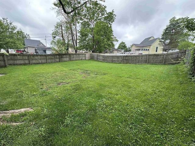 view of yard featuring a fenced backyard