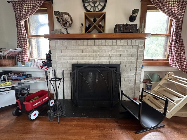 details with wood finished floors and a fireplace