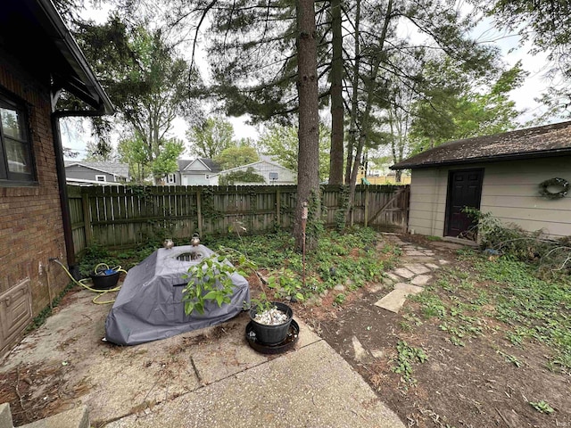 view of yard with a fenced backyard and a patio
