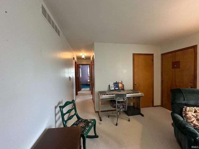 office featuring light carpet and visible vents