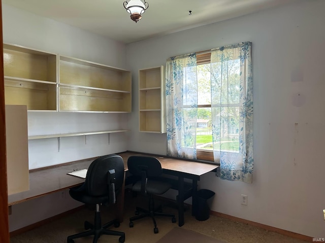 office area with baseboards and built in desk