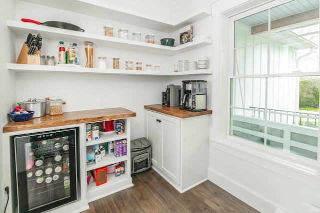 1284 E Zinnia Dr, Bloomington, IN 47401 - bar with baseboards, dark wood-style floors, a healthy amount of sunlight, and wine cooler