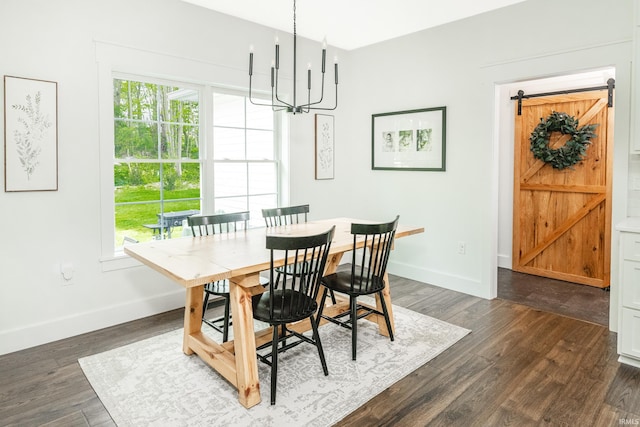 1284 E Zinnia Dr, Bloomington, IN 47401 - dining space with an inviting chandelier, baseboards, dark wood-style flooring, and a barn door