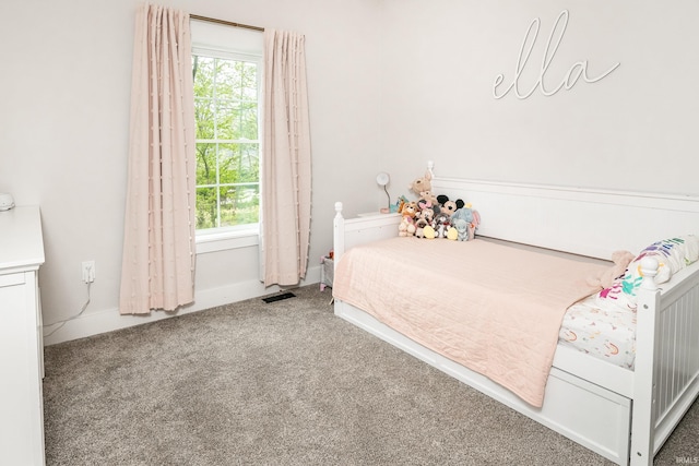 1284 E Zinnia Dr, Bloomington, IN 47401 - bedroom with carpet floors, visible vents, and multiple windows