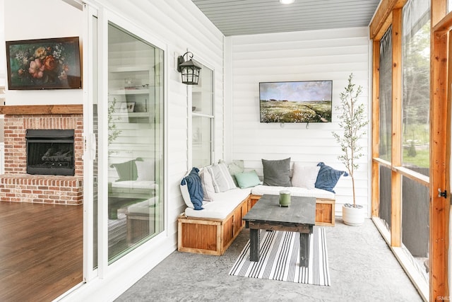 1284 E Zinnia Dr, Bloomington, IN 47401 - sunroom featuring an outdoor living space with a fireplace