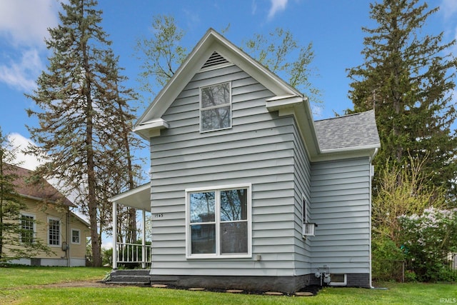 1743 Franklin Ave, Fort Wayne, IN 46808 - back of house featuring a shingled roof and a yard