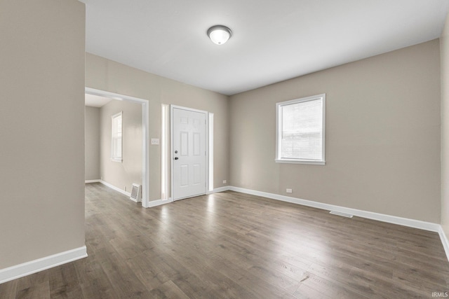 1743 Franklin Ave, Fort Wayne, IN 46808 - empty room with baseboards, dark wood finished floors, and plenty of natural light