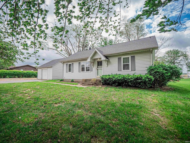 ranch-style house featuring driveway, a front lawn, and a garage