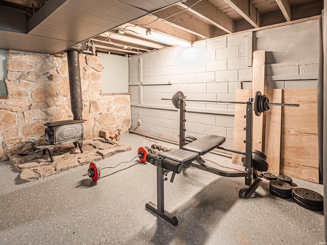exercise room with a wood stove