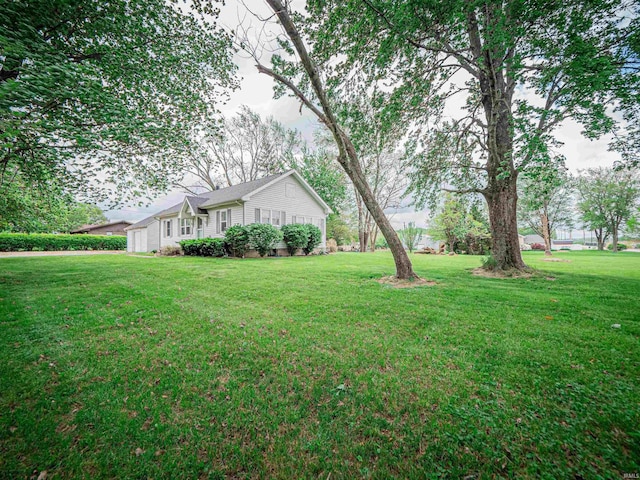view of yard featuring a garage
