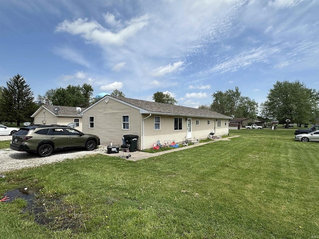 view of side of home featuring a lawn