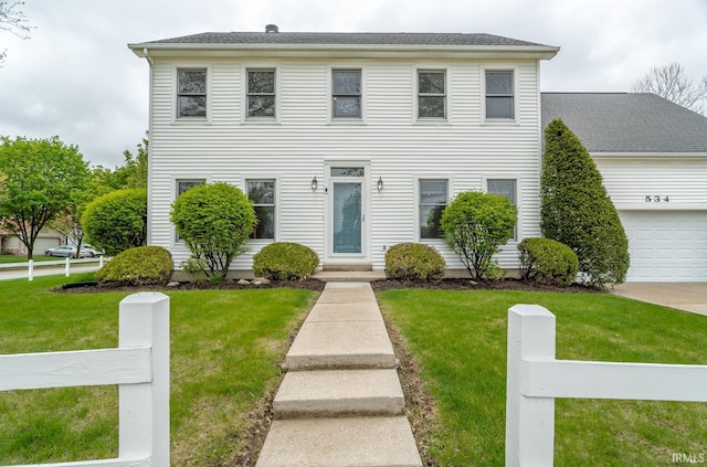 534 Lagrange St, West Lafayette, IN 47906 - colonial-style house featuring an attached garage, fence, and a front yard