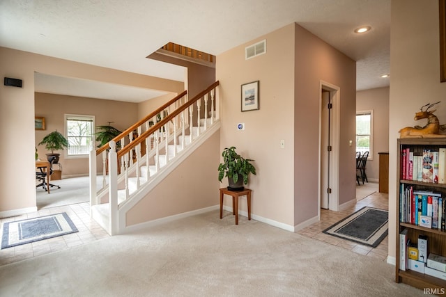 534 Lagrange St, West Lafayette, IN 47906 - staircase featuring carpet flooring, visible vents, and a healthy amount of sunlight