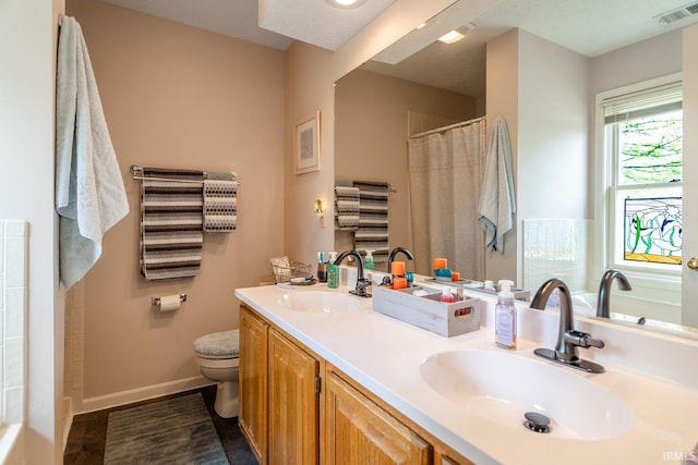 534 Lagrange St, West Lafayette, IN 47906 - full bath featuring a sink, toilet, double vanity, and visible vents
