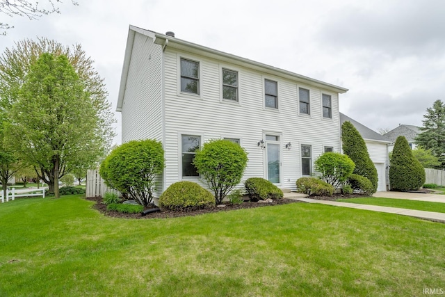 534 Lagrange St, West Lafayette, IN 47906 - colonial inspired home featuring fence, driveway, a front yard, and a garage