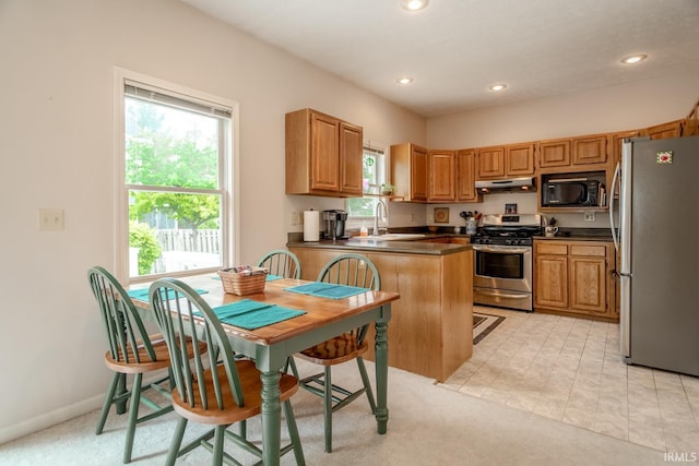 534 Lagrange St, West Lafayette, IN 47906 - kitchen featuring a peninsula, dark countertops, recessed lighting, a sink, and stainless steel appliances