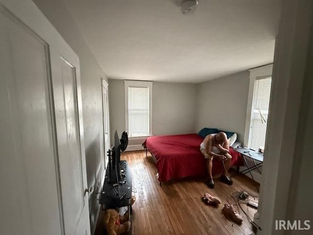 bedroom with wood finished floors