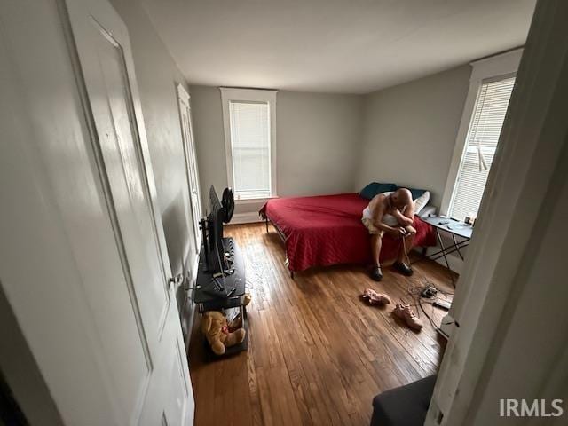 bedroom with wood finished floors