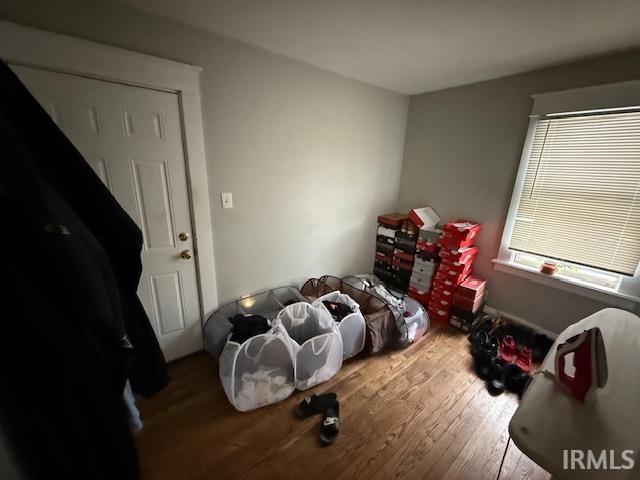 bedroom featuring wood finished floors