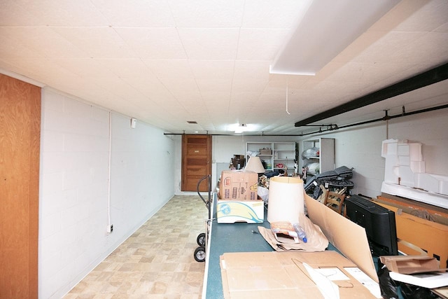 finished basement featuring tile patterned floors