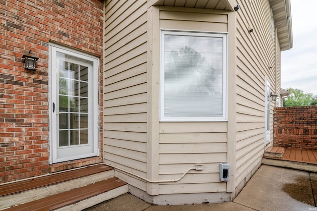 68106 Telegraph Ct, Lakeville, IN 46536 - view of side of property with brick siding and entry steps