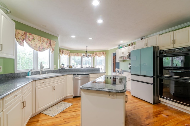 68106 Telegraph Ct, Lakeville, IN 46536 - kitchen with a sink, ornamental molding, black appliances, and light wood-type flooring