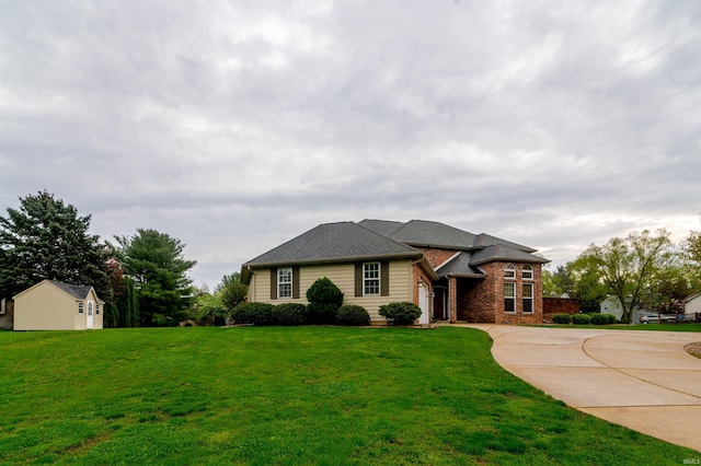 68106 Telegraph Ct, Lakeville, IN 46536 - view of front of house featuring an outdoor structure, a garage, a front lawn, a shed, and driveway