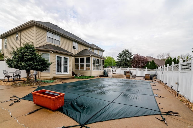 68106 Telegraph Ct, Lakeville, IN 46536 - view of swimming pool with a sunroom, a fenced backyard, a wooden deck, and a fenced in pool