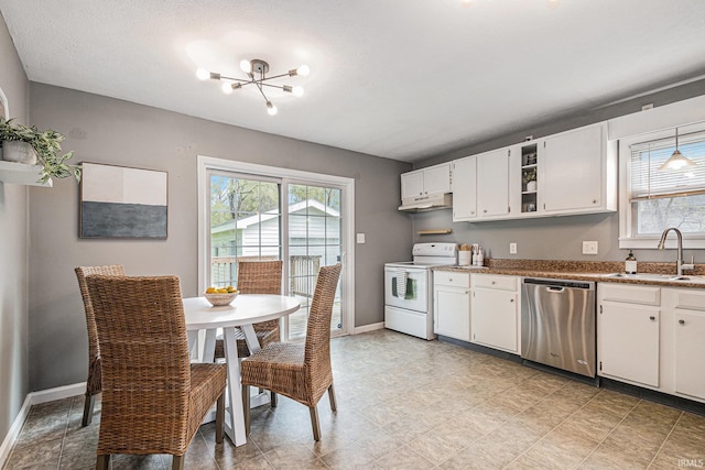kitchen featuring stainless steel dishwasher, electric range, a wealth of natural light, and a sink