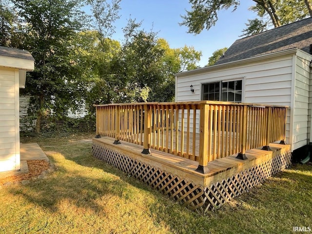 wooden terrace with a yard