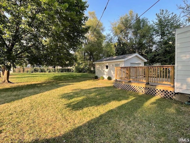 view of yard featuring a wooden deck and an outdoor structure
