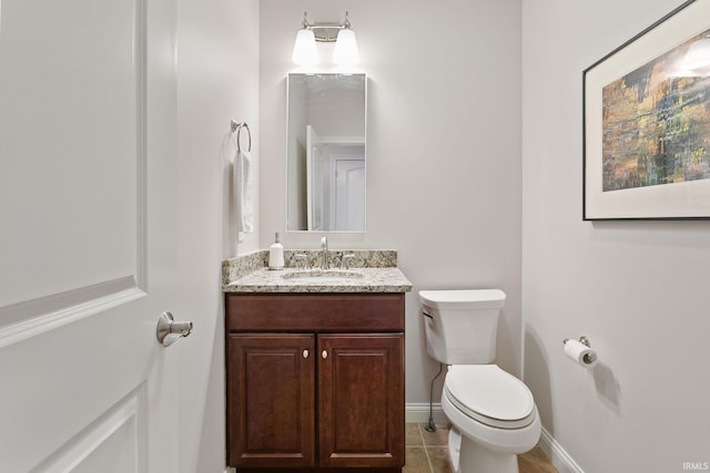 54637 Burdette St Unit 2, South Bend, IN 46637 - half bath with vanity, baseboards, tile patterned floors, and toilet