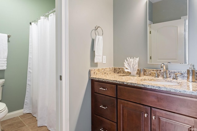 54637 Burdette St Unit 2, South Bend, IN 46637 - full bath with a shower with curtain, tile patterned flooring, vanity, baseboards, and toilet