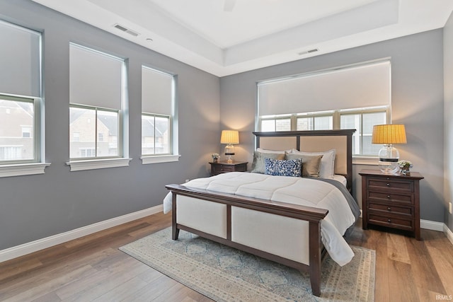 54637 Burdette St Unit 2, South Bend, IN 46637 - bedroom with a tray ceiling, visible vents, and multiple windows